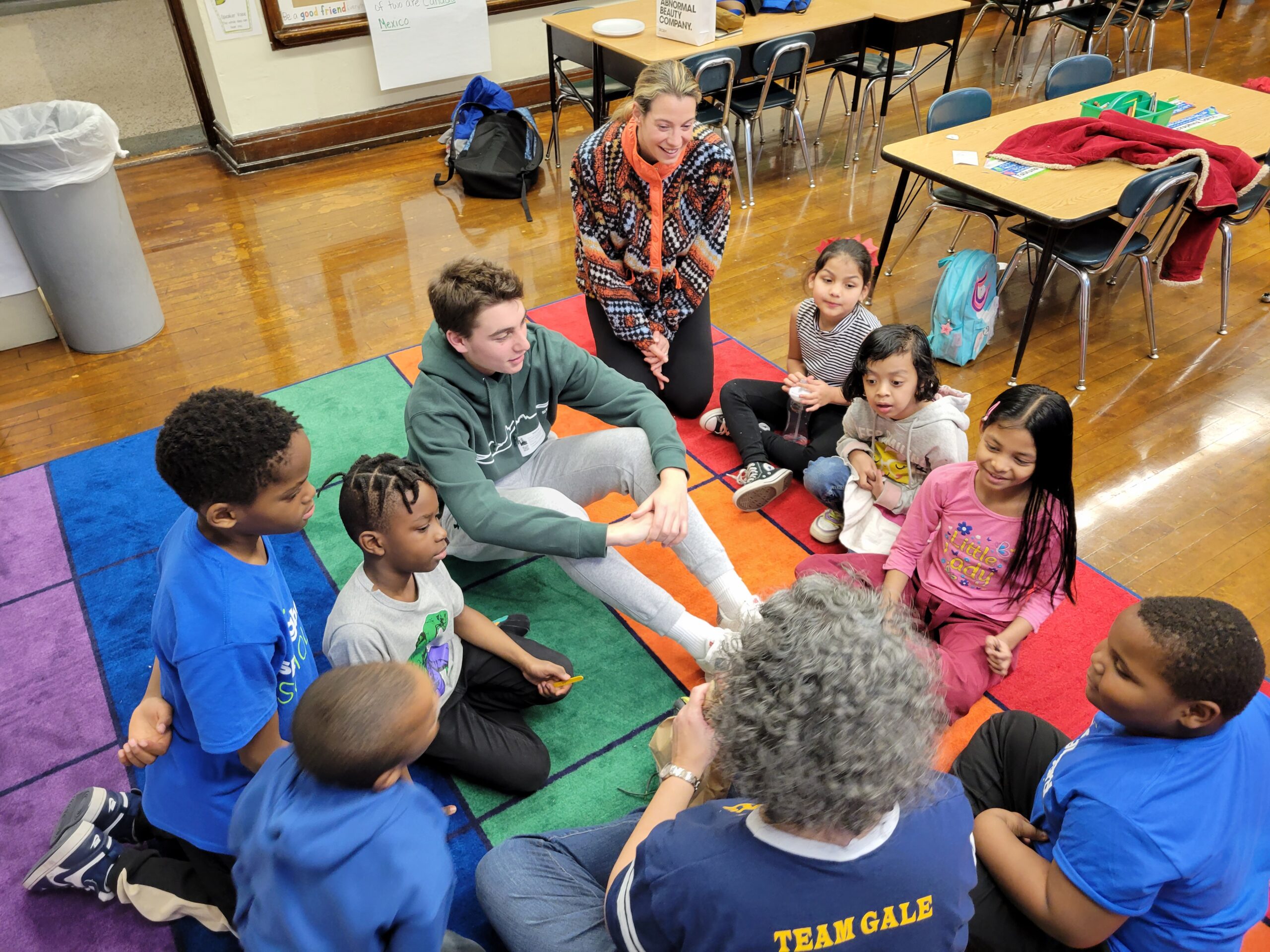 Student reading in a circle with a teacher